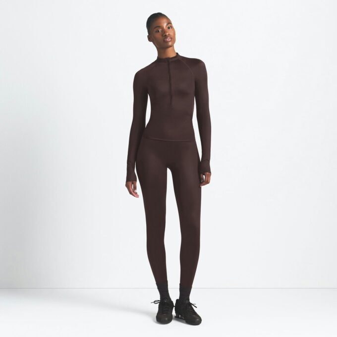 NikeSKIMS SHINE DŁUGI RĘKAW Z ZAPIĘCIEM DO PÓŁ NikeSKIMS SHINE DŁUGI RĘKAW Z ZAPIĘCIEM DO PÓŁ